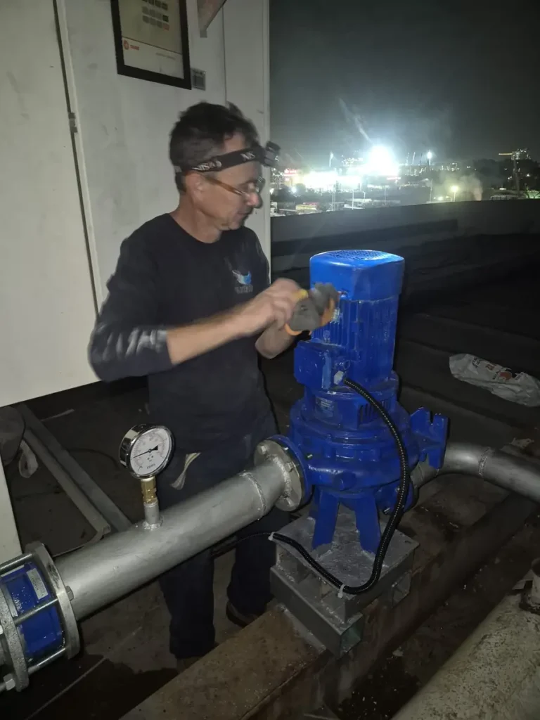 hvac water pump service rooftop night